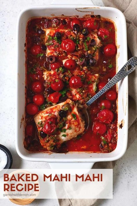 This simple, healthy Baked Mahi Mahi Recipe is loaded with Mediterranean flavor. Tomatoes, olives and capers create a rustic sauce for this mild-flavored fish, making it perfect to serve over pasta or rice. Take this easy dinner from oven to table in less than 40 minutes! Mediterranean Mahi Mahi Recipe, Baked Mahi Mahi Recipes, Mahi Mahi Recipes Baked, Mahi Recipes, Baked Mahi Mahi, Mahi Mahi Recipe, Recipe With Tomatoes, Canning Cherry Tomatoes, Mahi Mahi Recipes