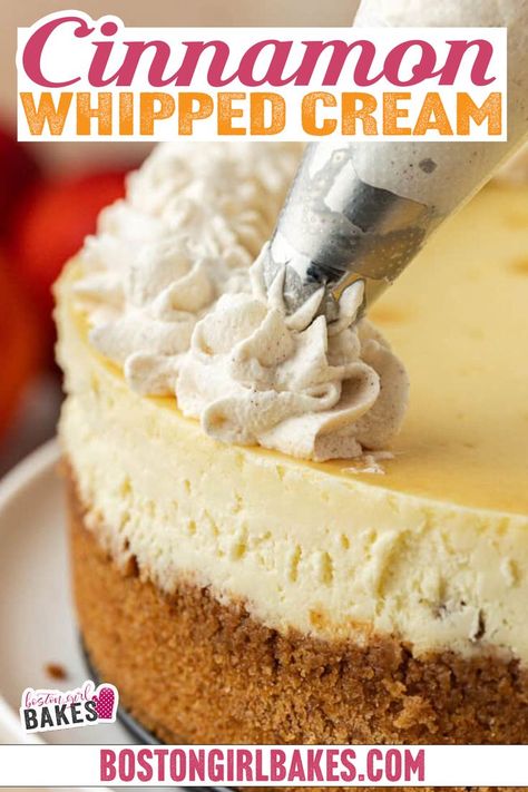 A cheesecake with a brown crust sits on a white cake stand. A piping bag is adding decorative swirls of cinnamon whipped cream to the top edge of the cheesecake. In the blurred background, there are some fruits, including strawberries and oranges. Cinnamon Whipped Cream, Whipped Cream Recipe, 4 Ingredient Recipes, Recipes With Whipping Cream, Cinnamon Recipes, Easy Cinnamon, Homemade Whipped Cream, Thanksgiving Desserts, Cream Recipes