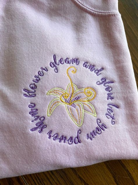 Rapunzel Flower Disney Tshirt Disney Sweatshirt | Etsy Rapunzel Flower, Embroidered Disney, Disney Tshirt, Disney Sweatshirt, Disney Sweatshirts, Disney Shirt, Disney Tshirts, Flower Shirt, Carolina Blue