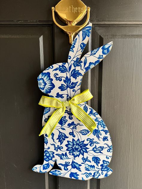 "Easter bunny door hanger measures 8 1/2\" x  18 1/2\".  decorated with ribbon." Chinoiserie Door Hanger, Rabbit Door Hanger, Art Booth, Hanger Ideas, Bunny Door Hanger, Easter Door Hanger, Painted Door, Softball Life, Easter Decorations Outdoor