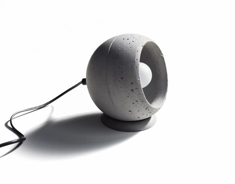 SUPERFLY-T is made of cast concrete. The concrete sphere could be rotated and placed in any position. Design by Urbi et Orbi studio in 2016. Pottery Lighting, Concrete Table Lamp, Concrete Light, Desktop Clock, Cement Diy, Concrete Lamp, Concrete Sink, Bathroom Furnishings, Concrete Table