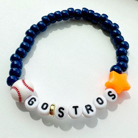 Handmade beaded stretch elastic bracelet. Navy mini pony beads with baseball and star bead accents and GO STROS lettering. ⚾️🧡 Show off your personality and Houston Astros baseball school spirit! One size fits most. Bead colors may vary slightly based on availability. Free shipping to US locations. Great gifts for the special person in your life 😊 Houston Astros Baseball, Astros Baseball, Mini Pony, Bead Bracelets, Elastic Bracelet, Pony Beads, Baseball Team, Bead Jewelry, Houston Astros