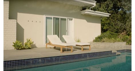 White padded lounge chairs face pool | Jacob Elordi Offers a Glimpse of His Cozy, Art-Filled Home | POPSUGAR Home Photo 5 Los Angeles House, Rock Lamp, Salt Rock Lamp, Jacob Elordi, Hollywood Sign, Los Angeles Homes, Celebrity Houses, Wooden Stools, Home Photo