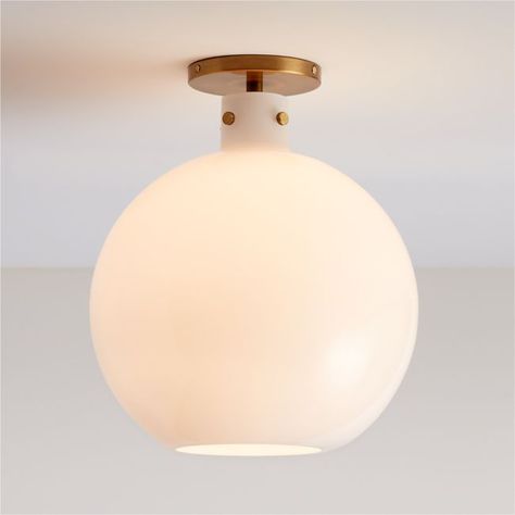 Detailed with oversized knurled screws, our Dakota flush mount light balances crisp modernity with subtle industrial beauty. The result is a timeless light fixture with a straightforward presence overhead. Hand-blown by talented artisans, the large white milk glass shade shapes a bulb-like globe that contrasts softly with the gleaming brass base and industrial-inspired screws. Our exclusive mix-and-match Dakota collection offers versatile lighting options with a custom feel.   • Hand-blown milk Timeless Light Fixtures, Hanging Lights Living Room, Antique Brass Ceiling Light, Brass Flush Mount Light, Brass Flush Mount, Light Balance, Flush Mount Light, Mount Light, White Milk Glass