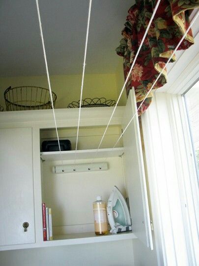 Retractible clothes line hidden in a cupboard. Laundry Storage Solutions, Laundry Lines, Clothes Lines, Laundry Room/mud Room, Laundry Room Cabinets, Laundry Room Remodel, Small Laundry Room, Small Laundry, Laundry Room Storage