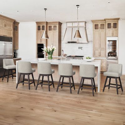 These classic swivel counter bar stools add a touch of elegance to your kitchen island or dining area. Both frames are made of solid wood and have a rural style dark brown surface. These bar chairs placed on the eight shaped legs with built-in support rods and are designed with footrest to keep your feet comfortable. The armless seats are upholstered in a foam-filled linen blend that provides lots of cushioning while you sit. And we love that their swivel design lets you move effortlessly withou Counter Stools With Backs, Stools For Kitchen Island, Bar Stools With Backs, Swivel Counter Stools, Stools With Backs, Wood Bar Stools, Counter Height Bar Stools, Bar Chair, Modern Bar Stools