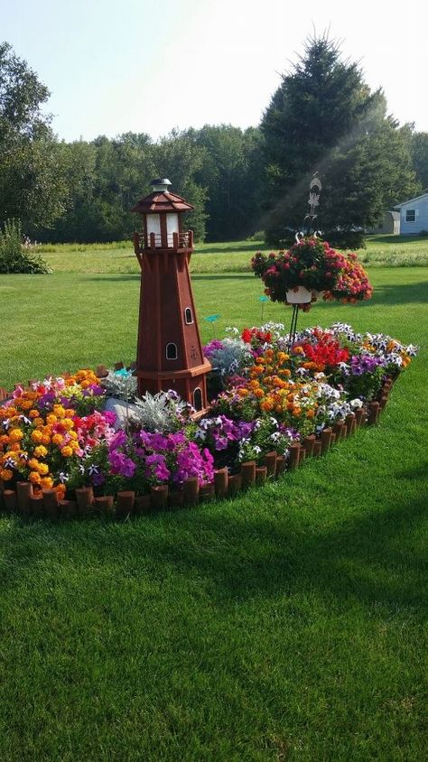 Kim M Faso Pettit's discussion on Hometalk. My Lighthouse Island - My garden lighthouse and flower bed. Spring Flower Arrangements Diy, Garden Lighthouse, Lighthouse Island, My Lighthouse, Diy Frühling, Nice Flower, Spring Flower Arrangements, Flower Bed Designs, Areas Verdes