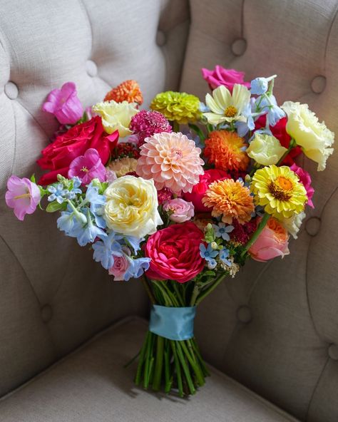 Vibrant petals for Megan’s beautiful bridal bouquet, bursting with the brightest, happiest colours you can imagine! 🌸💛💙💖 From hot pinks to electric blues, this bridal bouquet is all about vibrant vibes using a mix of bold and beautiful blooms for a truly colourful wedding at the iconic Fulham Palace, London. We got to embrace one of our favourite seasonal flowers, dahlias, and specialty blooms from @backyard__flowers with zinnia and cosmos! Who else is loving these colors as much as we a... Bright Peony Bouquet, Hot Pink And Blue Bouquet, Zinnia Bridal Bouquet, Bright Bridal Bouquet, Fulham Palace, Bright Wedding Bouquet, Flowers Dahlias, Orchid Bouquet Wedding, Luxury Florists