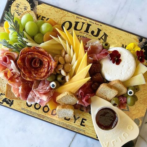 Babylon Cheese Cellar on Instagram: "More Spooky season inspiration coming right up! Try creating a board like this one on a Ouija board covered tightly in seal wrap! 💡 We styled this image for an upcoming @newsday article (stay tuned 😉) Shout out to @argyletoys for supplying the last minute Ouija Board (they have such a cute Halloween display right now). And a “you’re welcome” to anyone who caught a glimpse of me sprinting down Deer Park Ave with a Ouija board in order to meet the deadline ha Ouija Charcuterie Board, Cheese Cellar, Fondue Night, Disney Movie Night, Bday Party Theme, Create A Board, Deer Park, Ouija Board, Halloween Displays