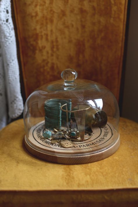 5 Ways To Use Glass Domes In Your Home Cheese Dome Decor Display, Glass Lantern Decor, Cheese Dome Decor, Glass Dome Decor Ideas, Glass Cheese Dome, Mini World, Cake Dome, Cheese Dome, Jewelry Decor