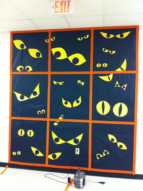 This gave me an idea- black paper, cut eye slits in it, put glow sticks or whatever behind it. Put on window for Halloween Veselý Halloween, Halloween Classroom Door, October Bulletin Boards, Halloween Bulletin Boards, Fall Bulletin Boards, Spooky Eyes, School Doors, Halloween Classroom, Halloween Door Decorations