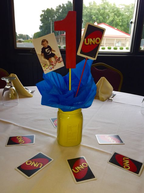 Uno centerpieces Uno Party Centerpieces, Uno Theme Centerpieces, Uno Centerpiece First Birthdays, Uno Birthday Party Theme Decoration, Uno Themed First Birthday Boys, Uno Decorations Ideas, Uno First Birthday Party Boy, Uno Birthday Party Theme, Uno Themed First Birthday