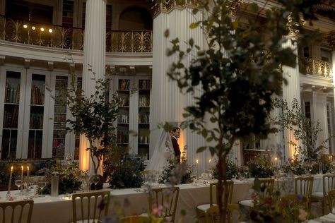 The bride and groom walk around their wedding breakfast at the Edinburgh wedding venue, Signet Library decorated with tall tree table centrepieces and purple wedding flowers for classic and traditional wedding Wedding Venues Library, Botanical Library, Bookstore Wedding, Edinburgh Wedding Venues, Enchanted Library, Edinburgh Wedding, Library Wedding, Beautiful Library, Pinterest Photography