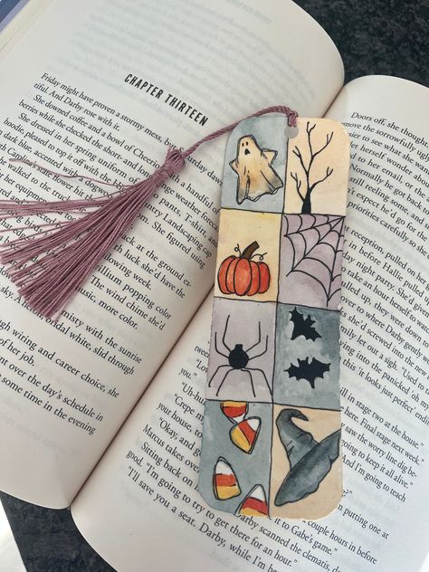 "This Halloween watercolor bookmark features a Halloween theme including ghosts, spiders, bars and more! It is the perfect bookmark to have during the fall/Halloween or even year round if you are a Halloween fanatic like me! This is a hand painted, made-to-order bookmark, so there may be slight differences than the picture above. It is 2\"x6\" and made with high quality watercolor paper and watercolor paints." Halloween Book Painting, Easy Bookmark Ideas Diy, Book Marks Homemade, Cute Simple Bookmark Designs, Fall Crafts School, Creative Book Marks Ideas, Thanksgiving Crafts For High Schoolers, Diy Bookmark Drawing, Handmade Halloween Gifts