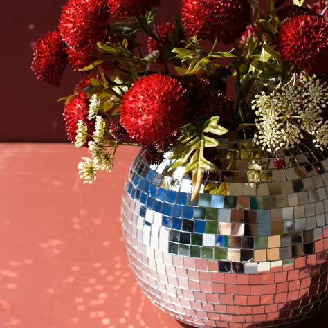 ✨Get ready to party with our Disco Ball Tabletop Planter! This treasure will dazzle guests and add a touch of unique style to your space. Use it to display your favorite stems, plants, or blooms and watch as they shine and reflect in the glass disco ball. Also makes a great wine or champagne bottle chiller! Now on sale, PLUS free shipping! 🕺💃🏾 #discoballcenterpiece #discoballplanter #discoballvase #mirrorballdecor #discoparty #honeybeehome #newyearseveparty #newyearsevedecor #FreeShipping #b... Disco Ball Planter, Honey Bee Home, Disco Ball Decor, Bed Headboard Storage, Tabletop Planter, Candle Wall Decor, Candle Matches, Party Room, Entertaining Kitchen