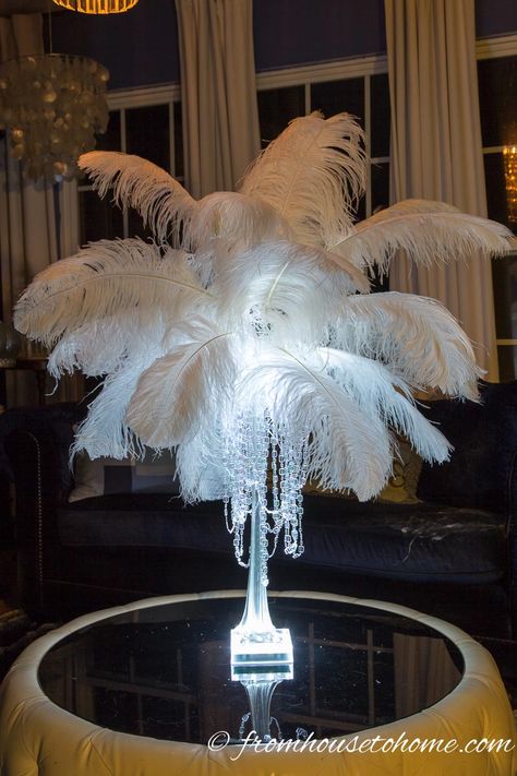 LOVE this glam DIY feather centerpiece! Such an elegant addition to my wedding decor, and making them myself will save me so much money! Ostrich Feather Centerpieces, Diy Feather, Feather Bouquet, Eiffel Tower Vases, Tower Vase, Feather Centerpieces, Bouquet Holder, Mini Led Lights, Great Gatsby Party