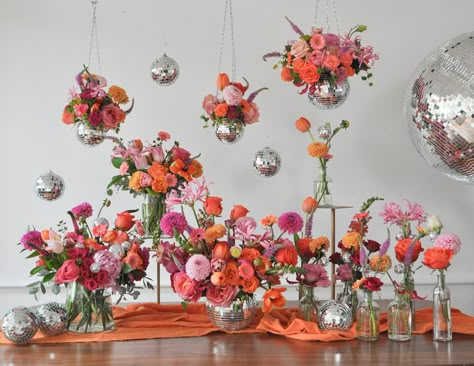 Boho Disco Centerpieces, Disco Party Flowers, Centerpiece With Disco Ball, Flower Bud Centerpieces, Centerpieces With Disco Balls, Disco Bloom Party, Disco And Flowers, Garden Party Disco Wedding, Wildflower Disco Wedding