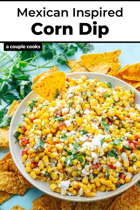 This Mexican street corn dip recipe is inspired by the irresistible flavors of street corn: lime, chili, cilantro and crumbled cheese! #corndip #mexicancorndip #mexicanstreetcorndip #mexicancorndiprecipe #dip #easydip #diprecipe #easydiprecipe #summerdip #summerappetizer Easy Mexican Appetizers, Mexican Street Corn Dip Recipe, Street Corn Dip Recipe, Mexican Appetizers Easy, Canned Corn Recipes, Appetizers Cold, Easy Bean Dip, Corn Dip Recipe, Mexican Corn Dip