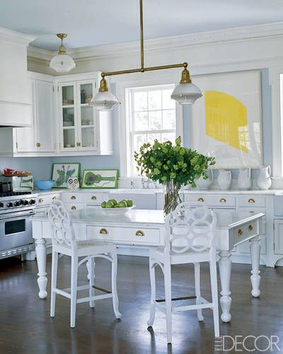 BRIGHT KITCHEN    In East Hampton, the kitchen light fixture is from Ann-Morris Antiques, the stools are vintage Frances Elkins, and the lithograph is by Ellsworth Kelly. Hampton Kitchen, House In The Hamptons, Ceiling Kitchen, Hampton Home, Led Kitchen, Summer Living Room, Aerin Lauder, Island Table, Hamptons House