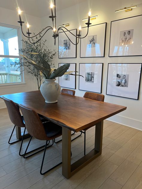 The sleek wooden dining room table paired with fake plants, a fancy chandelier, and a large black and white gallery wall of frames Dining Room Picture Wall, Hair Curtains, Thrift Store Home Decor, Hair Curtain, Bangs Curtain, Space Organization, Interior Design Per La Casa, Curtains Ideas, Bedroom Curtain