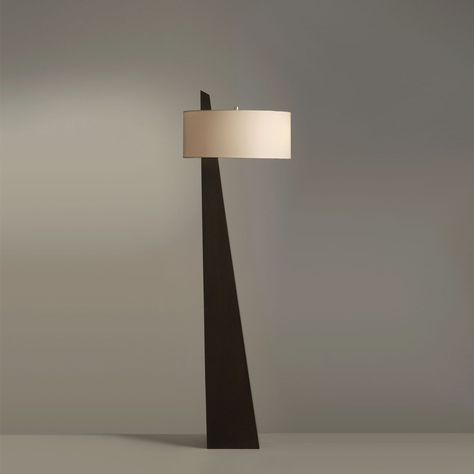 Striking lighting. This floor lamp’s sharply tapered pyramid silhouette brings a bold + angular accent to your space. A beige linen drum shade filters the light and layers in contrasting softness, but it’s set asymmetrically on the body for a final unexpected element. PRODUCT NOTES D 45cm x H 162cm / ∅ 17.7″ x H 63.8″. (59" plug cord) Black, Beige. SKU: RDF-190409 MATERIALS Iron body, fabric lampshade. E26 or E27 socket. (Not included bulbs) PRODUCT SHEET Abstract Lamps, Luxury Floor Lamp, Contemporary Floor Lamp, Executive Suites, Iron Body, Contemporary Floor Lamps, Fabric Lampshade, Black Floor, Black Floor Lamp