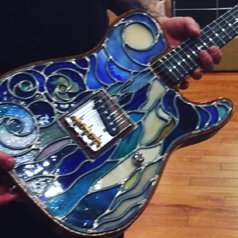 Fender stained glass guitar. It lights up and is worth let's just say a lot!! #WANT #fenderguitars Stained Glass Guitar, Guitar Mosaic, Stained Glass Music, Mosaic Guitar, Glass Electric Guitar, Fire Pit Cooking, Instruments Art, Fender Guitars, Stained Glass Patterns