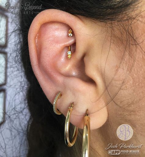 Have you ever seen a rookie so bling-ed 😱 Josh got to do this rook a while back using this @bvla curved bezel with tri bead accents, and he was stoked! This piece features two genuine White Diamonds set in solid 18k gold ☺️ . . . #bodyjewelry #bodypiercing #piercer #piercing #rookpiercing #earstyling #finejewelry #bvla #bvlalove #gold #18k #diamond #santabarbara #visitsantabarbara #805 #aboveandbeyondbodyarts #safepiercing #appmember Rookie Piercing, Piercing Bump, Piercing Inspo, Ear Party, Stacked Earrings, Lobe Piercing, Daith Piercing, Ear Stack, Dope Jewelry