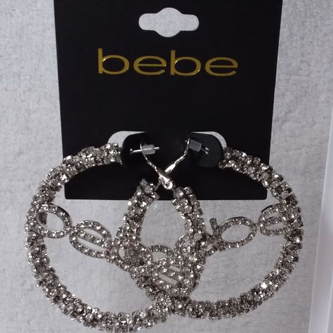 Hoop Pierce Earrings In Silver Tone With Clear Rhinestones With Logo Bebe By Bebe. New Without Tags. Did Not Removed From Card For Pictures. Measurements 2 Inches By 2 Inches. Measurements Done Laying Down Are Estimated. # A-I-24 Bling Hoop Earrings, Mcbling Jewelry, Png Earrings, Unique Piercings, 2000s Jewelry, Y2k Accessories, Y2k Jewelry, Shoulder Dresses, Body Jewelry Piercing