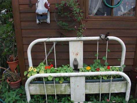 iron bed planter Plant Beds, Diy Hanging Chair, Junk Garden, Garden Center Displays, Rustic Bed, Repurposed Headboard, Iron Headboard, Rustic Bed Frame, Frame Landscape