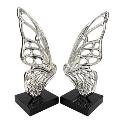 Introducing our Chrome Butterfly Resin Sculpture - a captivating blend of modern elegance and natural beauty. This stunning sculpture features two chrome wings with a special spiral center detail and intricate wing designs creating together a stunning Butterfly form sculpture. It rests on a sleek black base, creating a striking contrast. Perfect for any space, it's a unique gift for art and nature lovers. Add a touch of grace and sophistication to your decor with this exquisite butterfly sculptu Chrome Butterfly, Form Sculpture, Butterfly Sculpture, Butterfly Resin, Art And Nature, Resin Sculpture, Grey Home Decor, Wings Design, Functional Decor