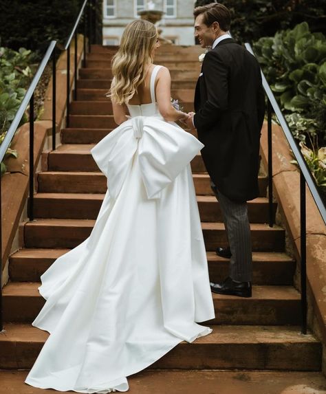 Wedding season has begun 😇 photos of real brides in some of the dresses we carry in the store! 1. Penelope corset and Sadie skirt from @preajames_bridal pc: @alicedoh 2. Luna gown from @ingridolicbridal pc: @lovehonorstudio 3. Dahlia gown from @halfpennylondon box: @halfpennylondon 4. Soraya gown from @j.andreatta_ pc: @whiteonblackstudio 5. Rene gown from @_houseofflora_ pc: @emmawilder_photography 6. Isabelle gown from @eisen.stein.bridal pc: @rachelchofloral 7. Winona mini with Bowi... Wedding Dresses With Bow, Square Neck Wedding Dress, Customized Dress, Dresses With Bow, Satin Wedding Dresses, Neck Wedding Dress, Bow Wedding Dress, Wedding Dresses Satin, Note Box