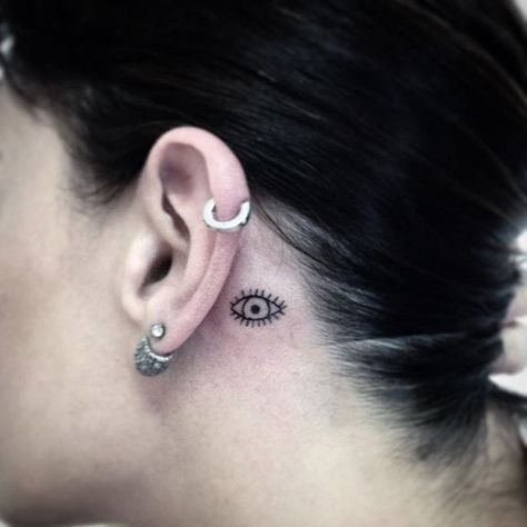 Subtle behind-the-ear tattoo by Wild and Wicked Tattoo. #ear #behindtheear #eye… Small Evil Eye Tattoo Behind Ear, Eye Behind Ear Tattoo, Behind Ear Tattoo Evil Eye, Evil Eye Ear Tattoo, Eye On Neck Tattoo, Eye Tattoo Behind Ear, Evil Eye Tattoo Behind Ear, Sweden Tattoo, Tattoo Ear