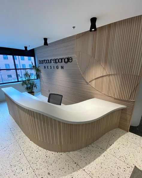 Justin Stabb on Instagram: "It was a pleasure bringing this reception desk to life, designed by @barbourspangle for their new office in @congdonyards. Be sure to check out the thermal formed corian and the logo integrated into the back wall. . . . . #receptiondesk #carpentry #corian #interiordesign #architecture #millwork" Arch Reception Desk, U Shaped Reception Desk, Check In Counter Design, Rounded Reception Desk, Curved Counter Design, Curvy Reception Desk, Oval Reception Desk, Curved Reception Desk Design, Reception Back Wall Design