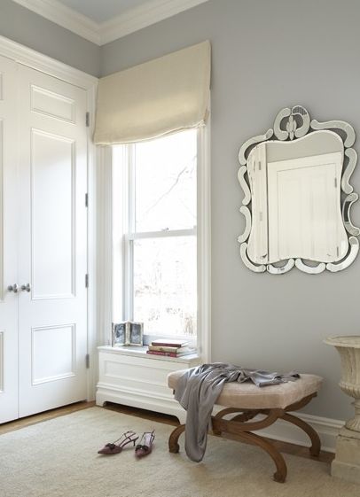 closets - blue gray walls mirror ottoman oatmeal linen roman shade Gray dressing room design with gorgeous gray blue walls paint color, mirror, Stonington Gray, Blue Grey Walls, Trending Paint Colors, Gray Walls, Bedroom Wall Colors, Paint Colors Benjamin Moore, Grey Paint Colors, Mirror On The Wall, Traditional Bedroom