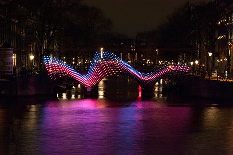 tjep. illuminates amsterdam's canals with undulating light bridge Bridge Lighting, Amsterdam Light Festival, Light Art Installation, The Shape Of Water, Light Festival, Amsterdam Canals, Facade Lighting, Urban Lighting, Amsterdam City