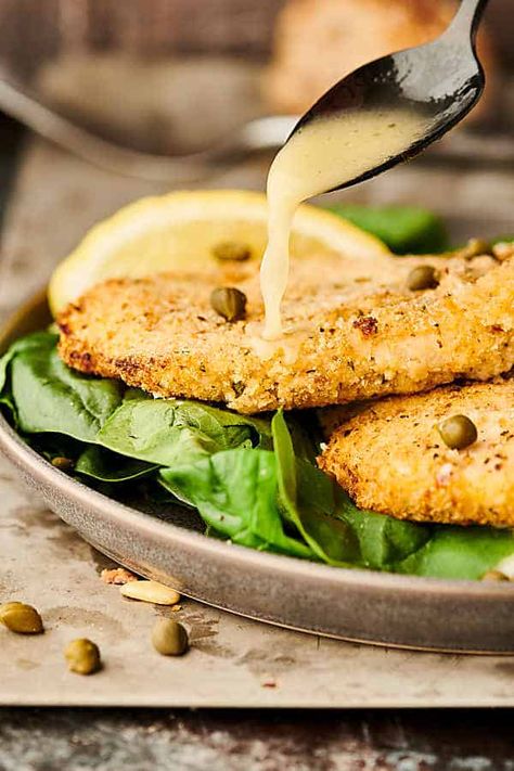 A lightened up version of a classic, this air fryer chicken piccata may be lighter in calories, but it's packed with flavor! Lightly breaded chicken is air fried to golden perfection and served with a butter lemon caper sauce. showmetheyummy.com #airfryer #chicken #piccata Air Fryer Chicken Piccata, Chicken Piccata Easy, Lightly Breaded Chicken, Airfryer Chicken, Panini Recipes Chicken, Lemon Chicken Piccata, Lemon Caper Sauce, Chicken Piccata Recipe, Caper Sauce