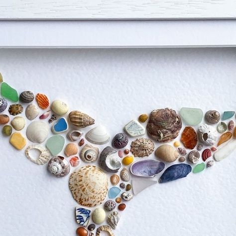 Nikki Fewings | Luxury Shell & Sea Glass Art📍Cornwall on Instagram: "Since you whaley loved my last whale fluke, here’s another that will soon be on the way to it’s forever home 🐋 Using only ethically handpicked Cornish shells, sea glass and sea pottery - handpicked by me, I might add! So many beauties in this one. The way that scallop fragment sits perfectly nestled into the shape of the large piece of sea glass 😍 #coastalartwork #seashellart #seashells🐚 #cornishmade #cornish #kernowfornia #shellcollector #shellcollection #cornishseaglass #seaglassart #scallopshell #cowrieshells #blueseaglass #northcornwall #bude #polzeath #padstow #whaletail #whaletails #mermaidtail #mermazing #prettycolors #prettycolours #undertheseatheme #artforwalls #coastalhomedecor #lilyandsea" Seaglass Ideas, Whale Fluke, Large Sea Shells, Seashell Artwork, Shell Artwork, Shell Yeah, Coastal Artwork, North Cornwall, Under The Sea Theme