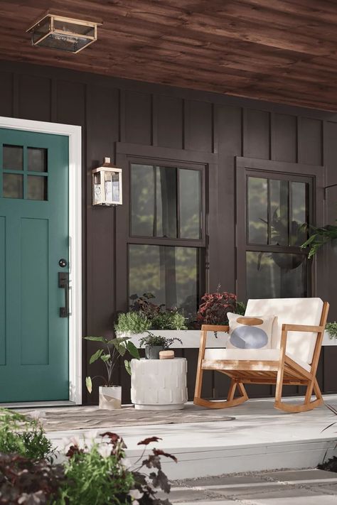 Popular exterior paint colors from Behr: inspiration for an update in 2022 - Hackrea Black House With Green Door, Front Door Colors For Brown House, Brown House Front Door Color, Brown House Exterior Ideas, Dark Brown Exterior House Colors, Emerald Green Door, Cabin Exterior Color Schemes, Brown Exterior House Colors, Behr Exterior Paint Colors