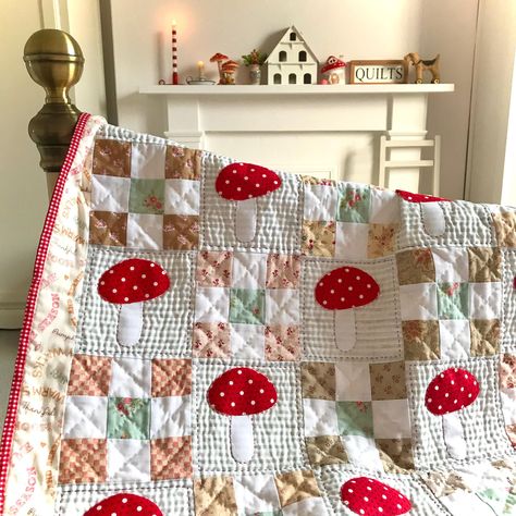 This little quilt is a celebration of the whimsical autumn favourite...the red spotted toadstool. It is made with patchwork, applique and hand quilting to create lots of texture and give a rustic feel. It is a throw size quilt but can easily be made into a larger quilt by increasing the number of blocks. Perfect for cosy fall days! Size: 38in x 32in (96.52 x 81.28cm) approx Kids Quilted Blanket, Patchwork Quilt Designs, Throw Blanket Quilt, Old Fashion Quilt Patterns, Mushroom Quilt Pattern, Quilting Aesthetic, Quilting Projects Ideas, Simple Quilt Pattern, Mushroom Quilt