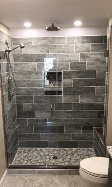 Half Wall Tile Shower Ideas, Gray Tiled Showers Walk In, Grey Tile Shower Bathroom, Black And Grey Shower Tile, Modern Restroom Ideas Shower Tiles, Gray And Black Shower Tile Ideas, Modern Master Shower Tile Ideas, Gray Tiled Shower Ideas, Dark Gray Shower Floor