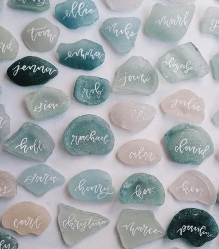 eco friendly wedding decor and gift ideas sea glass name cards Beach Wedding Unique Ideas, Wedding By The Sea Decor, Costal Wedding Centerpiece, Wedding Ideas Sea, Ocean Wedding Centerpieces, Sea Glass Wedding Centerpieces, Seaglass Name Cards Wedding, Seafoam Wedding Theme, Rustic Ocean Wedding