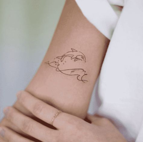 Dolphin Tattoo Design Images (Dolphin Ink Design Ideas) Simplistic Dolphin Tattoo, Dolphin Tattoo Ideas For Women, Small Dolphin Tattoo Ideas, Wave Dolphin Tattoo, Dolphin Back Tattoo, Dolphins Tattoo For Women, Cool Dolphin Tattoo, Fineline Dolphin Tattoo, Mini Dolphin Tattoo