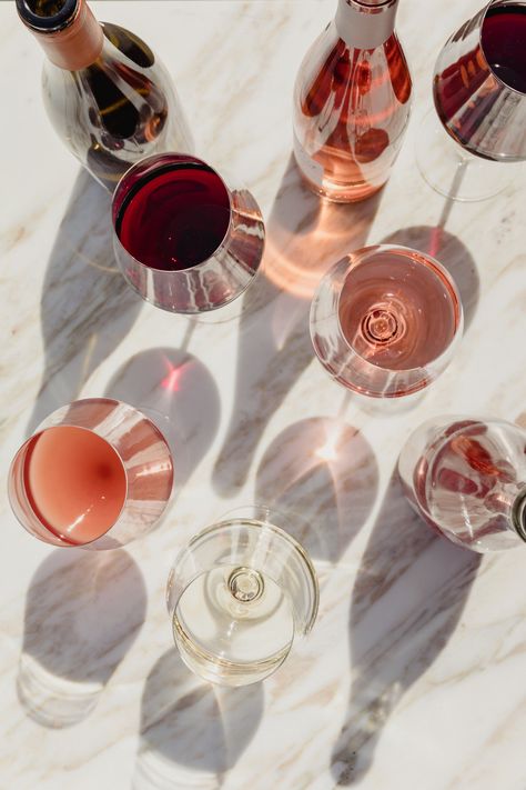 overhead image of rose wines on a marble surface Wine Glass Photography, Rose Wine Glass, Wine Aesthetic, Food Flatlay, Wine Images, Glass Photography, Wine Photography, Drink Photography, Red And White Roses