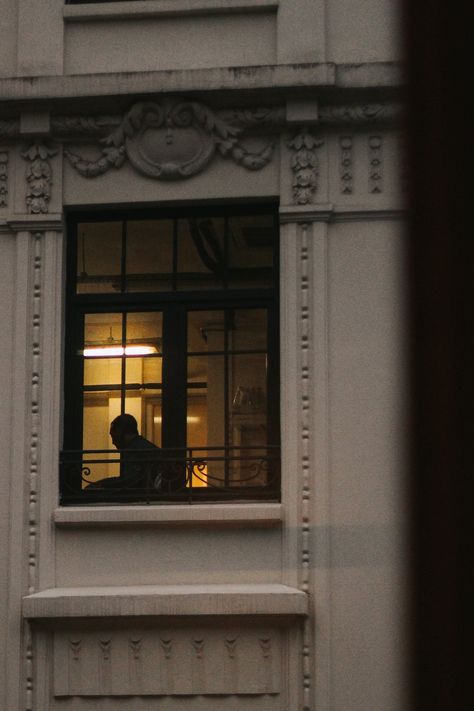 Person Leaning Out Of Window, Looking Through Window, The Dark Between Stars, Fearless Song, Silhouette Of A Person, High Contrast Photography, Romance Book Aesthetic, Contrast Photography, Manga Sketch