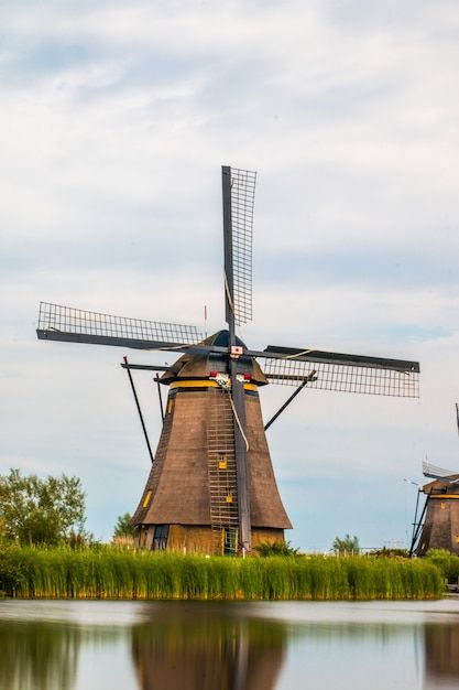 Kinderdijk windmills next to rotterdam a... | Premium Photo #Freepik #photo #water-mill #rural #field #farm-field Kinderdijk Windmills, Mill Painting, Dutch Mill, Windmills Photography, Windmill Photos, Farm Windmill, Water Wheels, Photo Water, Rotterdam Netherlands