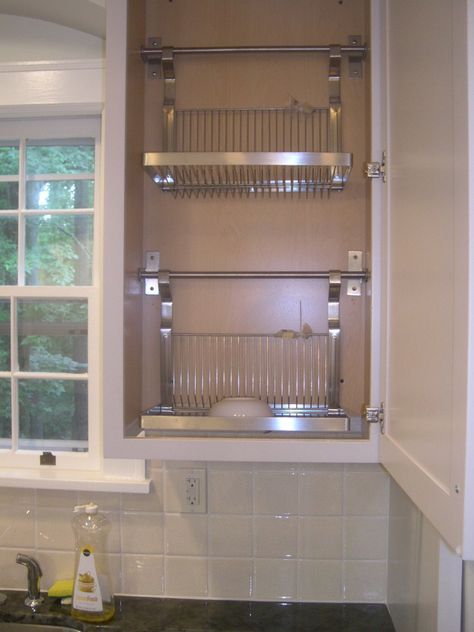 I had the bottom of a standard wall cabinet cut out and installed 2 ikea drying racks inside. I then asked the countertop installers to grind grooves and a slight slant into the granite allowing water dripping from the drying cabinet to run directly into the sink. Kitchen Rack Design, Kitchen Sink Drying Rack, Drying Cabinet, Tiny Kitchens, Sink Drying Rack, Drying Racks, Dish Drainers, Dish Rack, Kitchen Rack