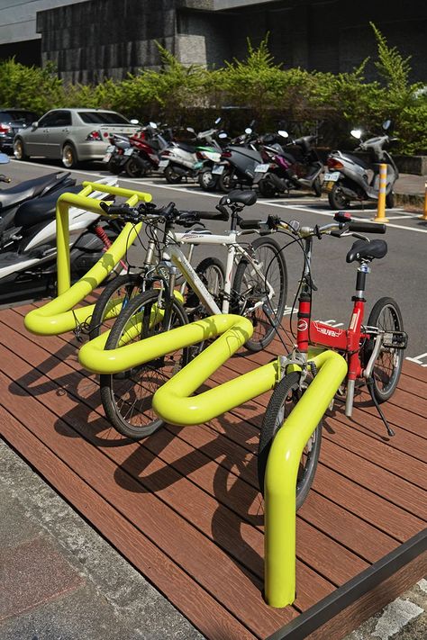 tube rack reclaims urban spaces for bikes & public seating in taipei Bicycle Parking Design, Bike Stands, Public Furniture, Cycle Stand, Bike Holder, Public Space Design, Urban Forest, Public Seating, Indoor Bike