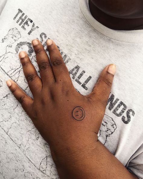 Hand tattoo inspo by Seattle-based tattoo artist @ruffenough. Click the link to see more great hand tattoos. #handtattoo #handtattoos #tattooinspiration #tattoo #tattoos #tattooinspo #darkskintattoo #smileyface #smileyfacetattoo #smileytattoo #tinytattoo #smalltattoo #sticknpoke #sticknpoketattoo #stickandpoke #stickandpoketattoo #handpoked #handpokedtattoo #handpoke #machinefreetattoo #qttr Smiley Hand Tattoo, Smiley Face Hand Tattoo, Face Hand Tattoo, Unique Hand Tattoos, Smiley Face Tattoo, Dark Skin Tattoo, Tiny Tats, Hand Tattoo Designs, Skin Tattoo