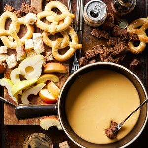 Cider-Cheese Fondue | Better Homes & Gardens Swiss Cheese Fondue Recipe, Classic Cheese Fondue, Halloween Potluck Ideas, Cheddar Fondue, Slow Cooker Dips, Halloween Potluck, Best Dip Recipes, Fondue Recipes Cheese, Fondue Recipe