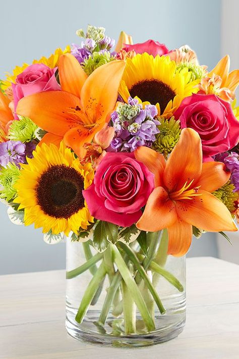 Pink Roses, Orange Lilies, and Sunflowers $50 and up - Or, try this brighter best-selling option from 1-800 Flowers, featuring hot pink roses and carnations, orange lilies, yellow sunflowers, and lavender stock. See more perfect Mother's Day flowers and gift ideas at GoodHousekeeping.com. #MothersDay #MothersDay2018 #MothersDayFlowers (If you click to buy, we earn $$$) Săpunuri Handmade, Thanksgiving Flowers, Vibrant Bouquet, Hot Pink Roses, Colorful Bouquet, Local Florist, Bright Flowers, Flowers Online, Vibrant Flower